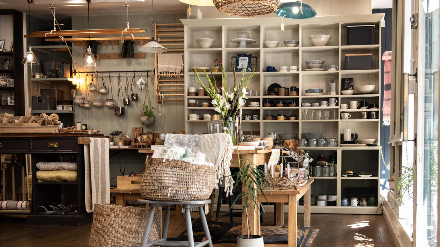 Shop interior showing dining area, lighting and storage products