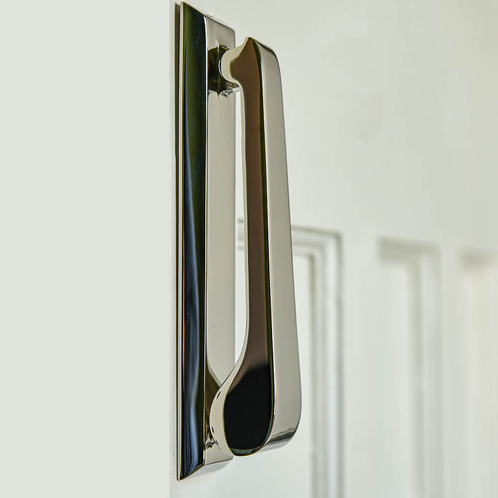 Plain slim door knocker seen from the side view