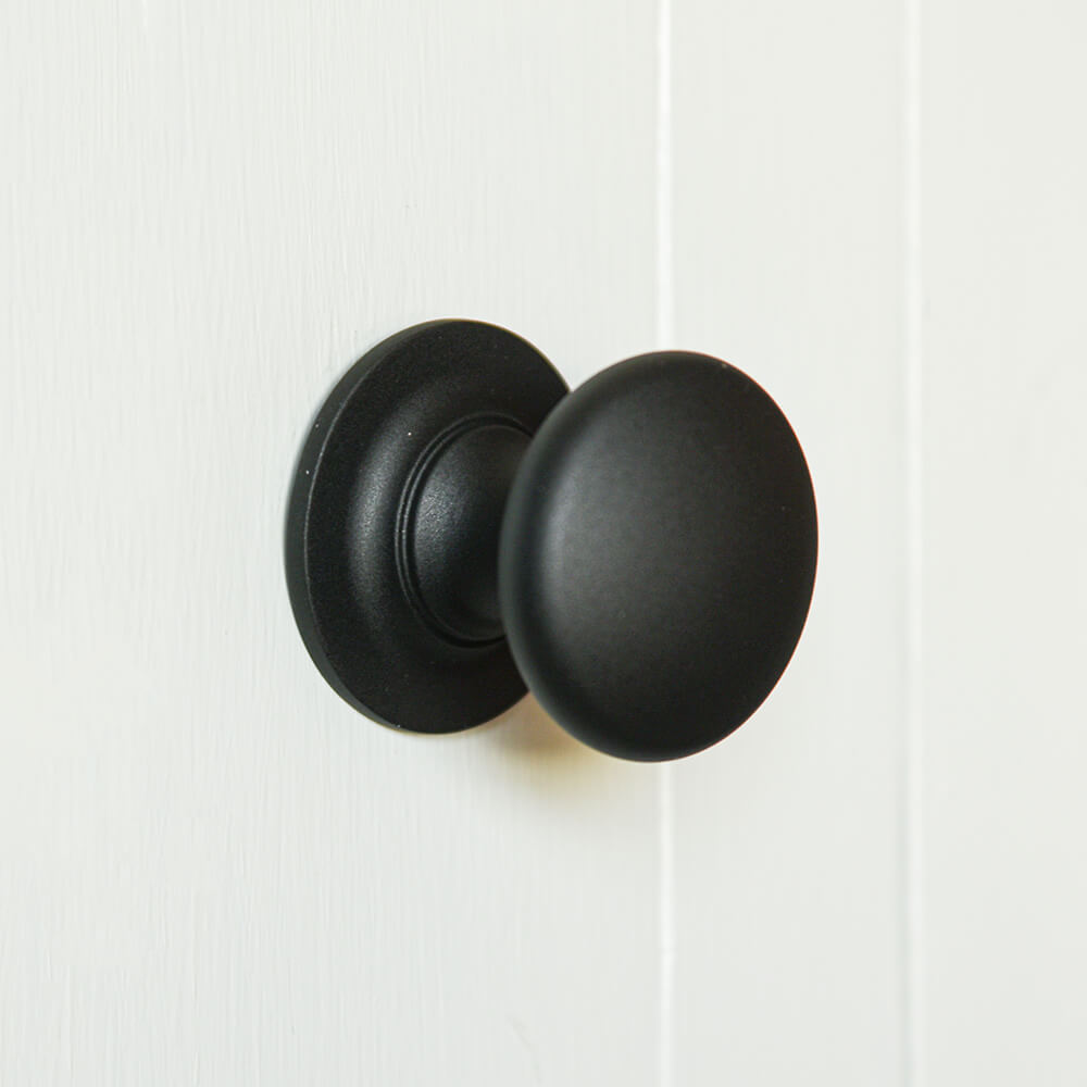 Matt black cupboard knob with a beautiful flat texture
