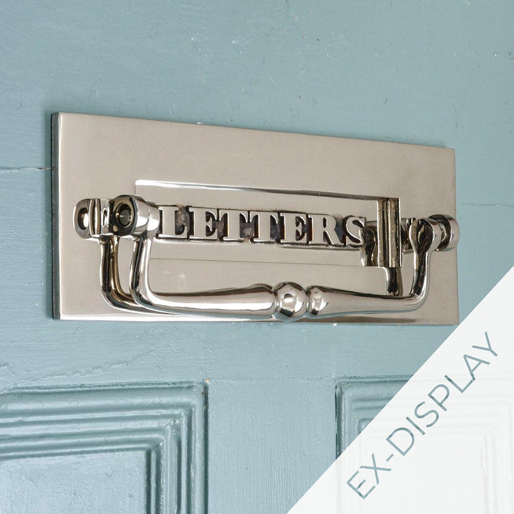 Aged nickel classic letters letterplate with clapper on a blue door with a watermark and ex display text in the corner