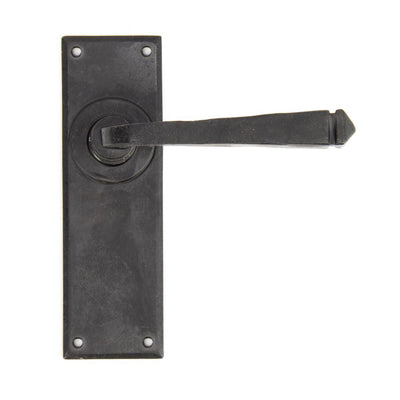 Exterior black Avon lever latch handles with a beeswax finish against a white background