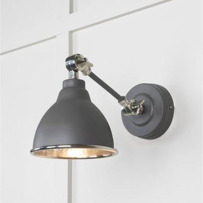 Hammered nickel Brindley wall light in dark grey against a white panelled wall