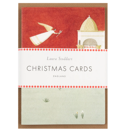 Pack of Christmas cards with a design of a angel and a building on a red background, featuring the brand 'Laura Stoddart'.