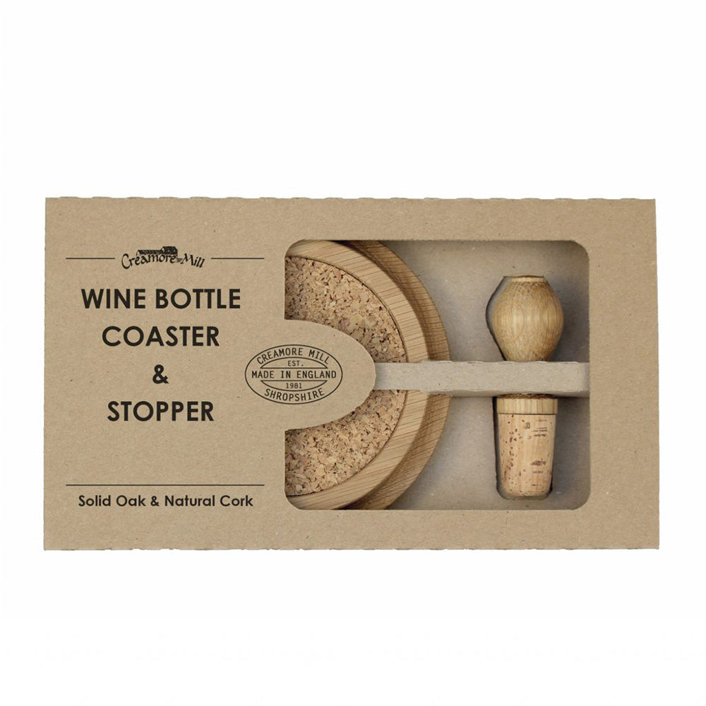 Oak and cork wine bottle stopper and coaster set packaged in a brown cardboard box with part of the products visible