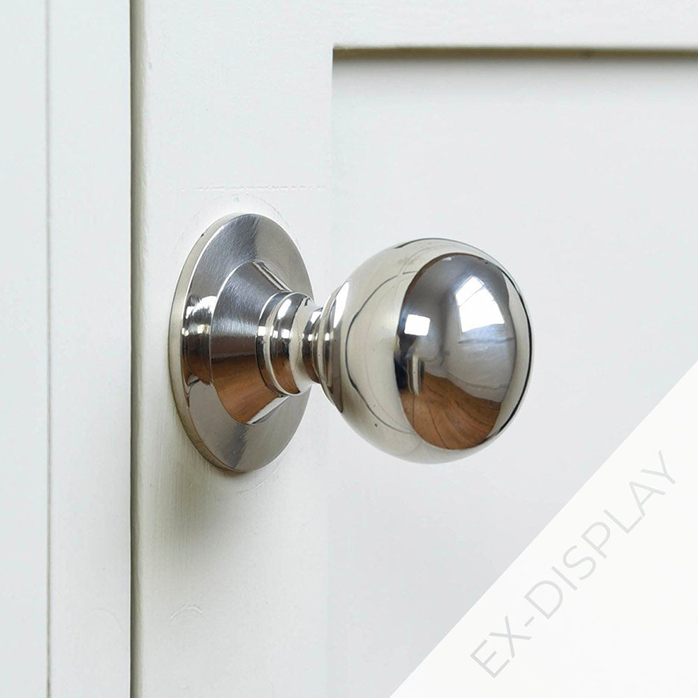Ex display polished nickel round ball cabinet knob on pale grey background with an ex-display watermark in the corner