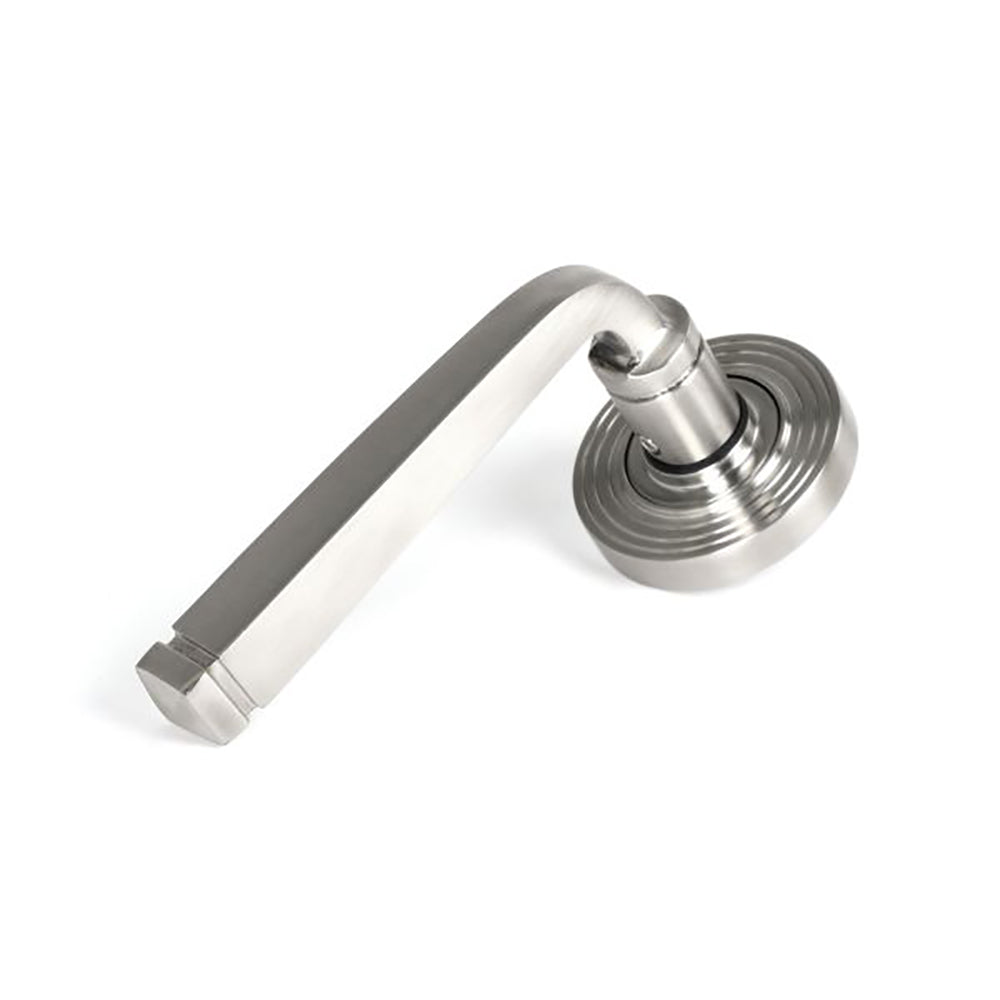 Satin stainless steel avon lever handle on concealed beehive circular rose against white background