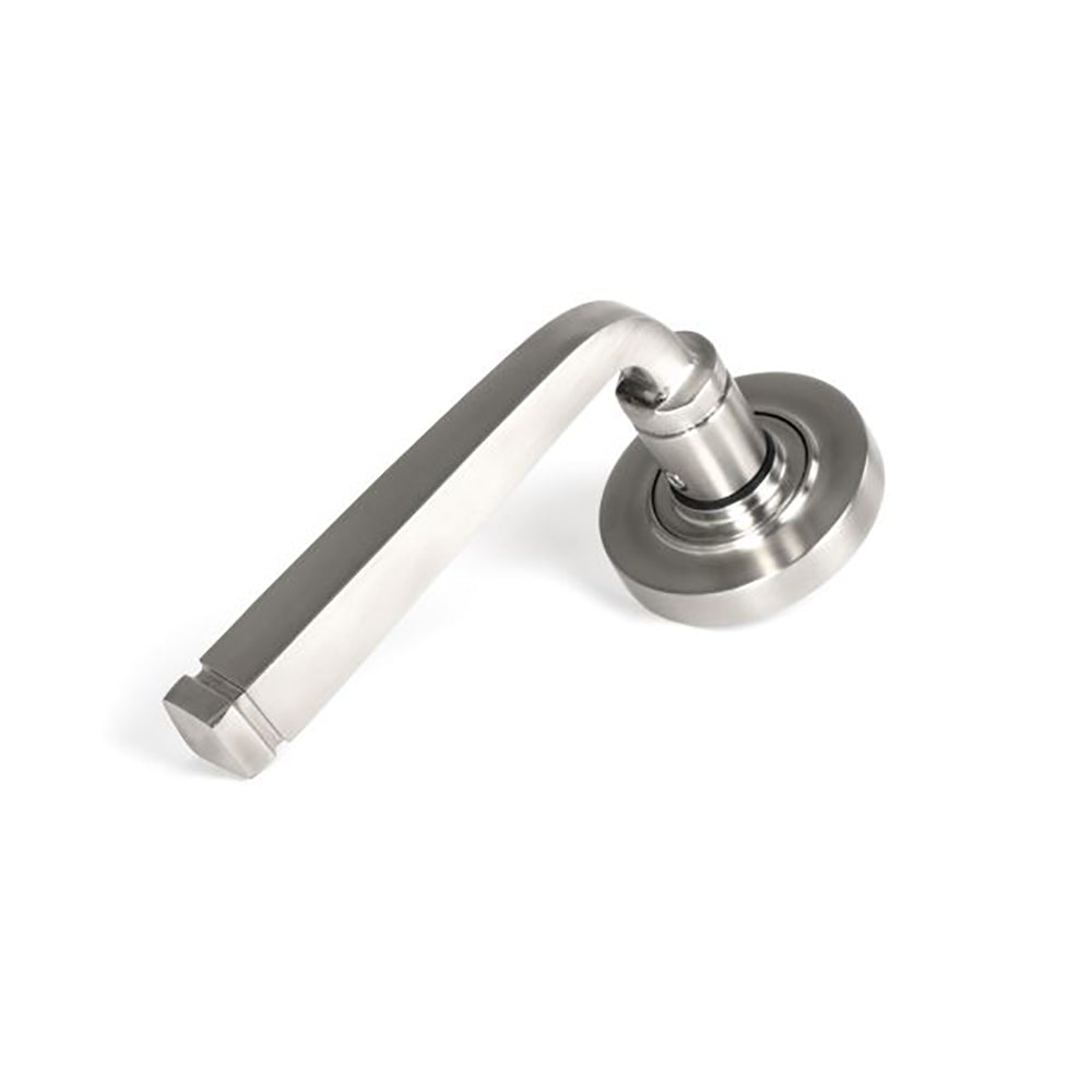 Satin stainless steel avon lever handles on concealed plain circular rose