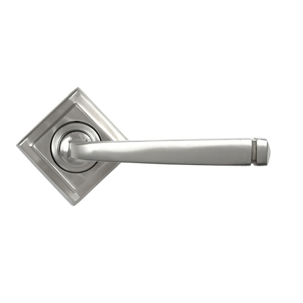 Front view of satin stainless steel avon lever handles on square concealed rose