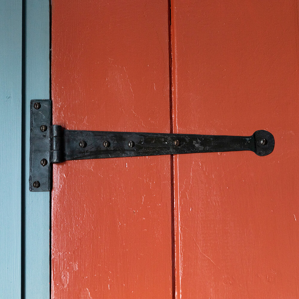 12 inch T Hinge in black beeswax on red door