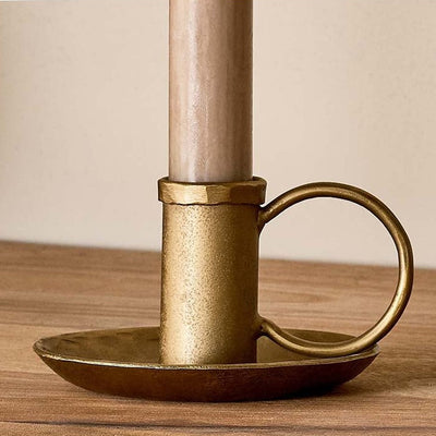 Close up of brass candlestick holder with handle