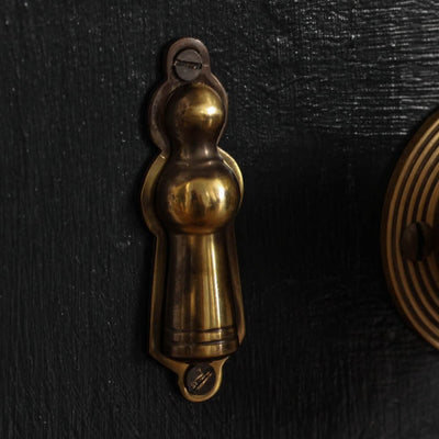 Aged brass skittle escutcheon