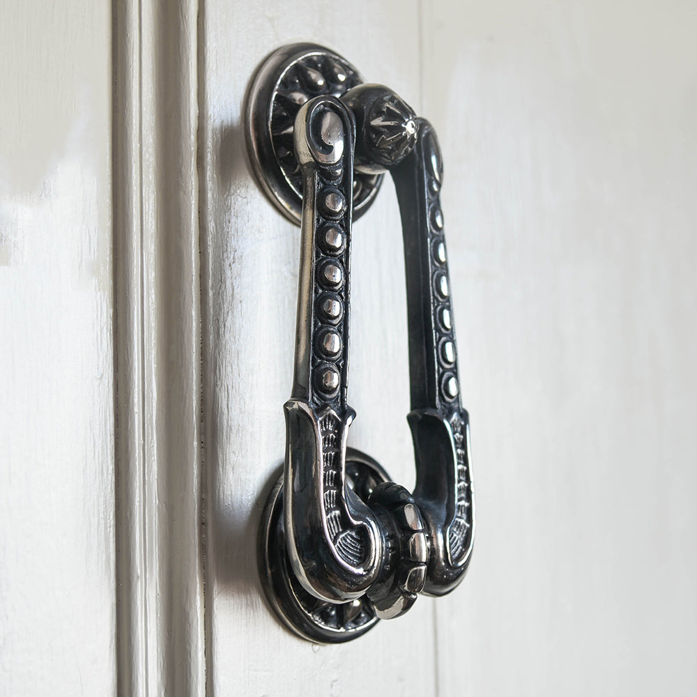 Aged nickel regency style door knocker