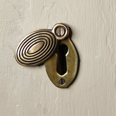 Aged Brass Oval Beehive Escutcheon keyhole cover shown open