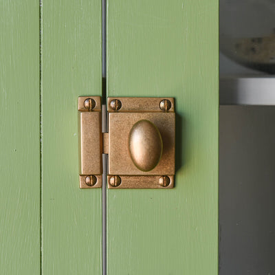 Aged Brass Traditional Oval Cabinet Latch on glazed doors