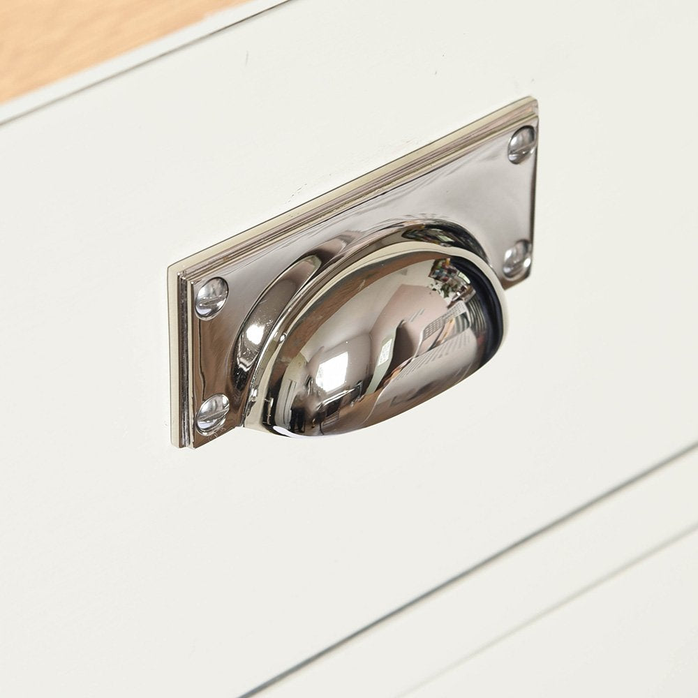An art-deco style drawer pull in a polished nickel finish