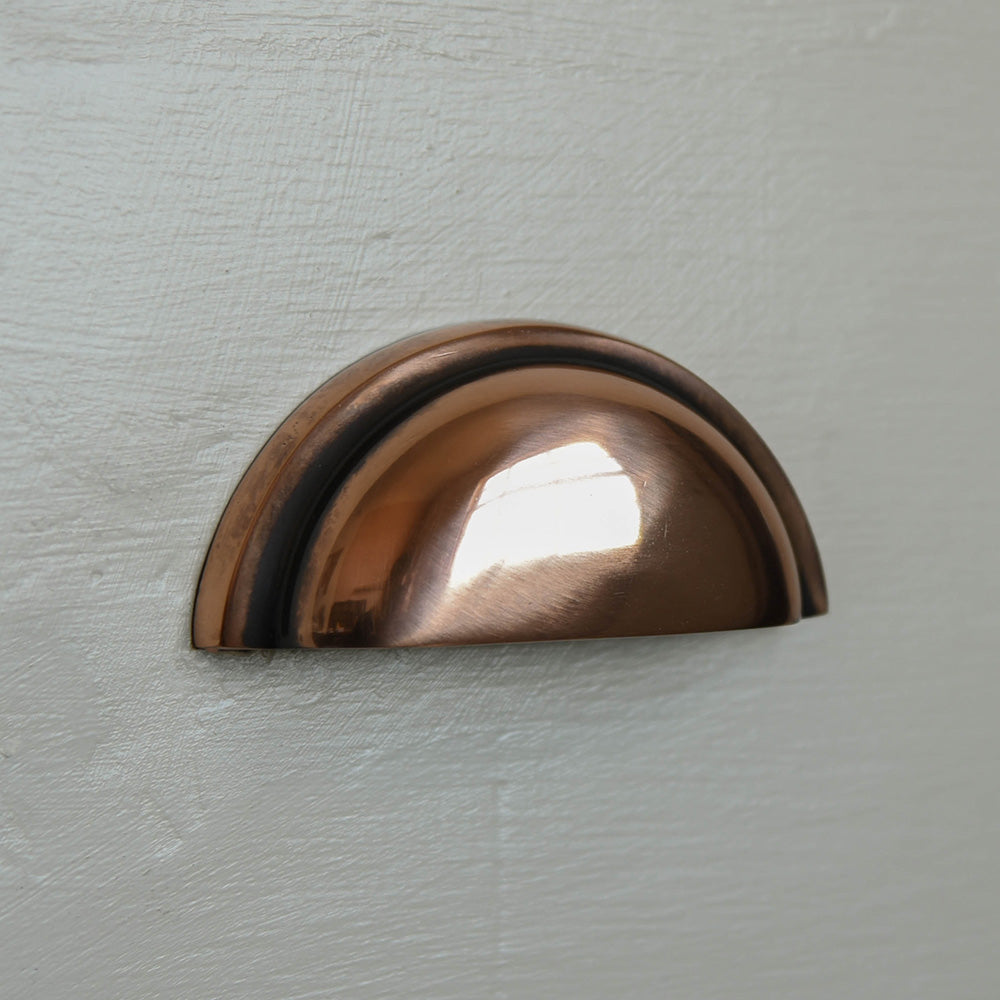 The regency concealed drawer pull showing the bronze patina
