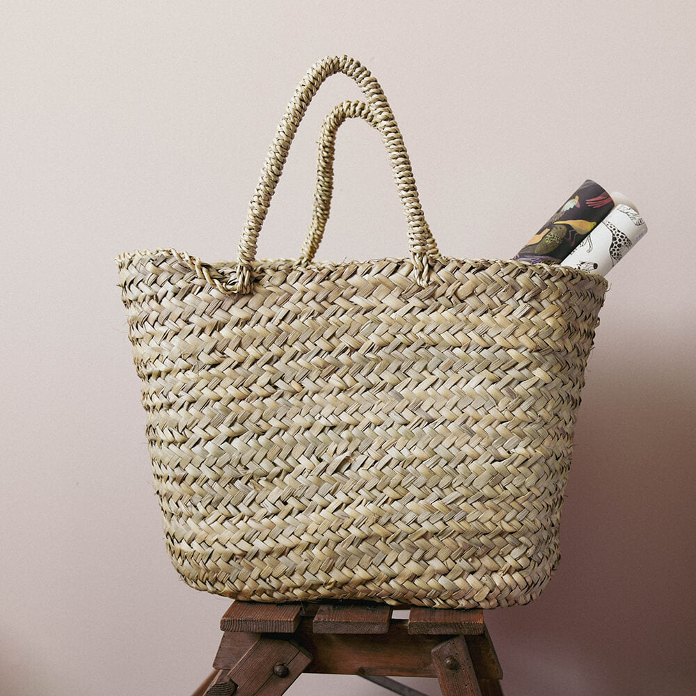Berber basket with rug on vintage ladder