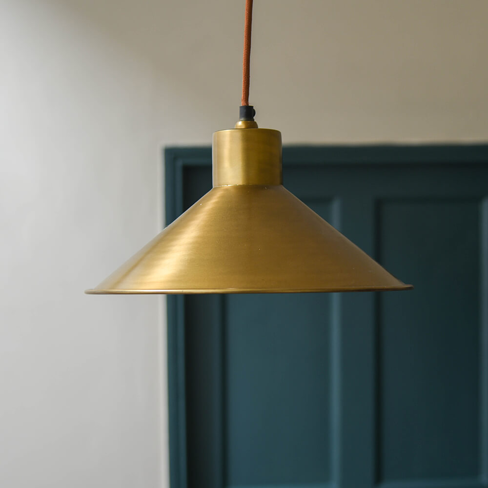 Antique Brass Chanpi Pendant Light lit in a hallway