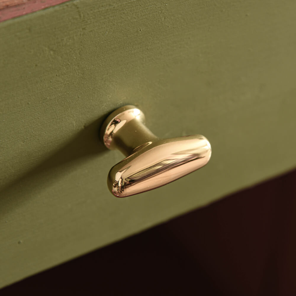 Polished Brass Elegance Cabinet Knob on green drawer