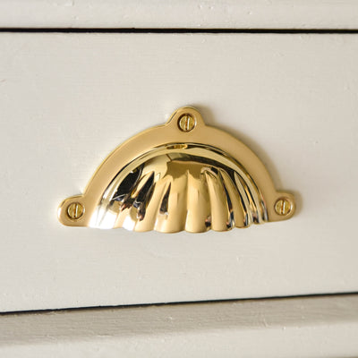 front facing scalloped edge drawer pull