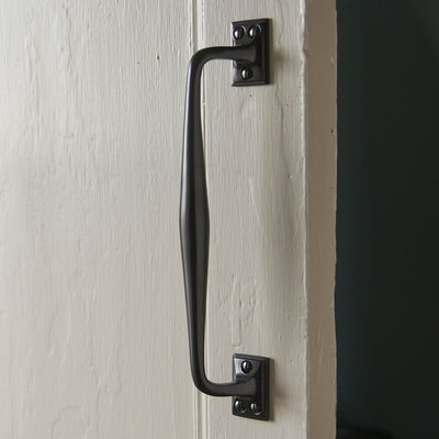 Bronze pull handle for large cabinets on door