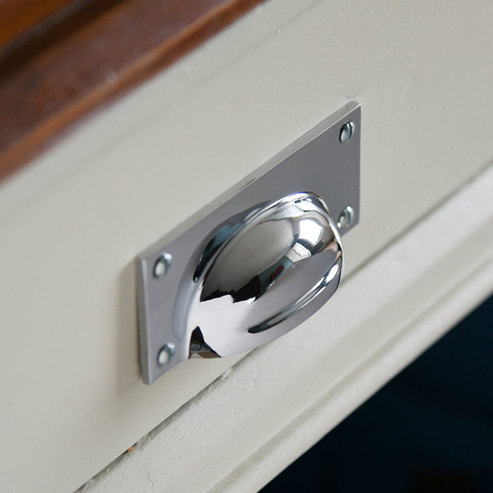 Chrome cup handle on drawers