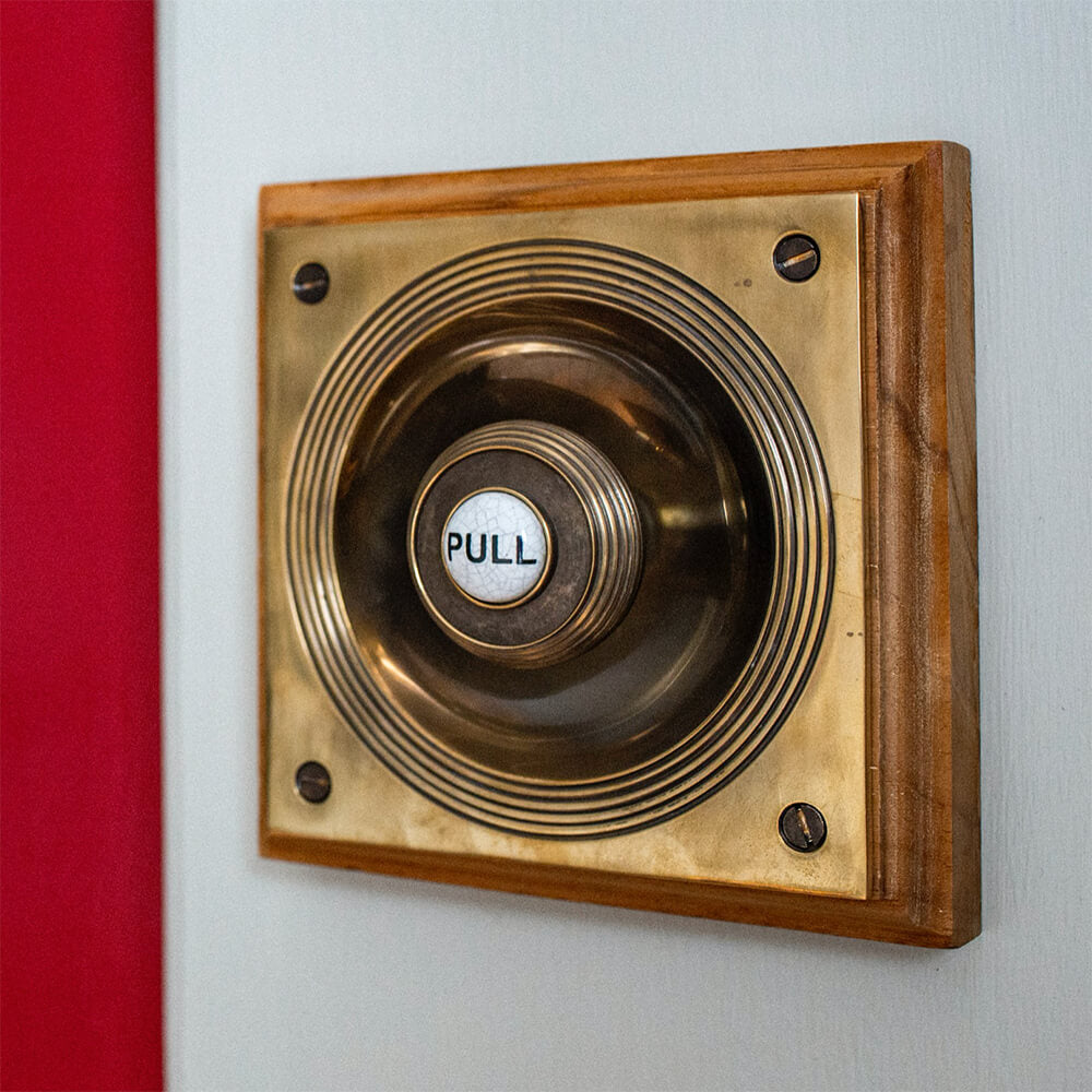 Brass Claverley Bell Pull on red door
