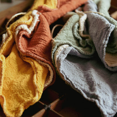 colourful dusters and cloths in a pile