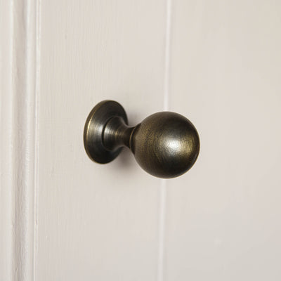 Antique brass ball shaped cabinet knob