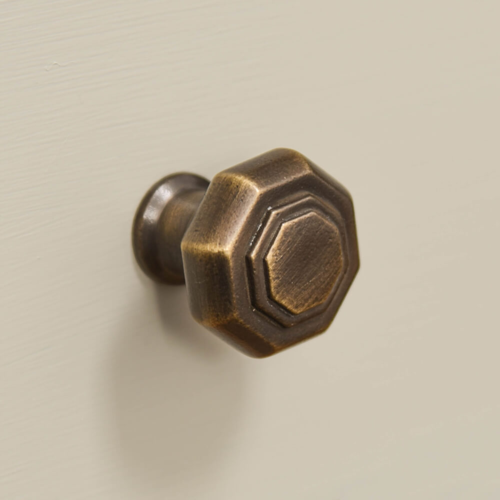 Distressed Antique Brass Flat Octagonal Cabinet Knob from the front