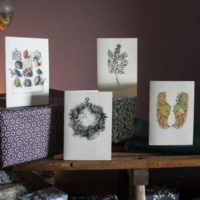 A selection of Elena Deshmuk Christmas Cards featuring Christmas Paraphernalia