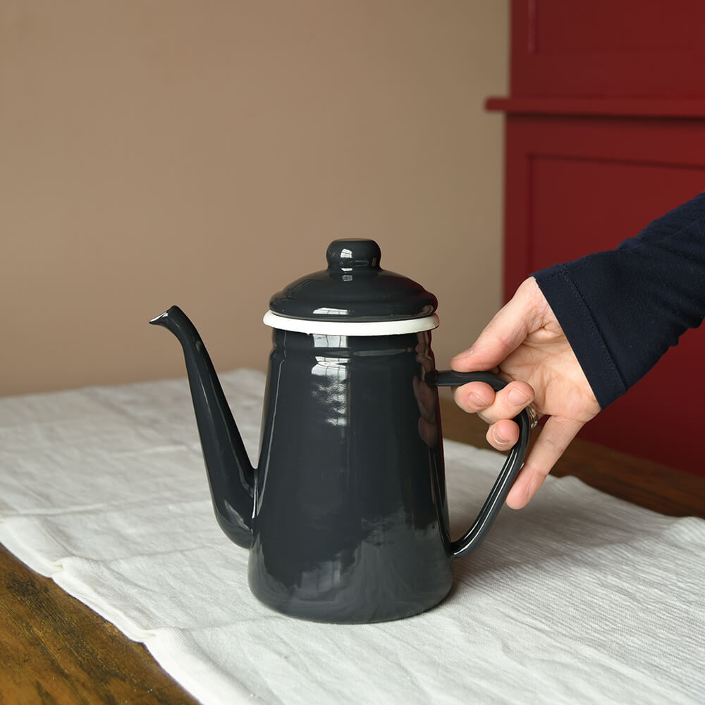 Enamel Coffee Pot - Carbon on a table