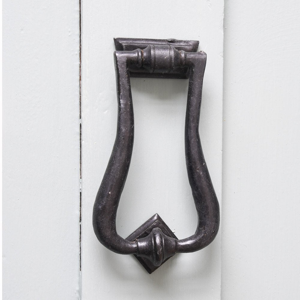 A Berkeley Looped Door Knocker in Black Beeswax fitted to a front door