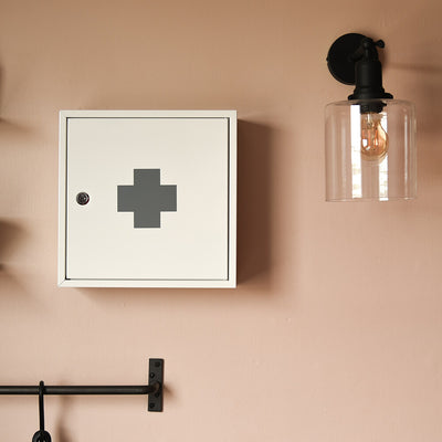 First aid cabinet mounted on the wall