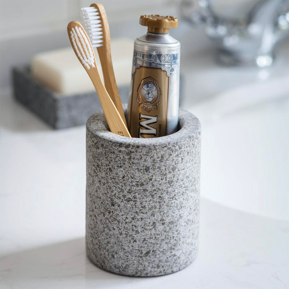 Granite toothbrush holder with toothbrush and toothpaste inside