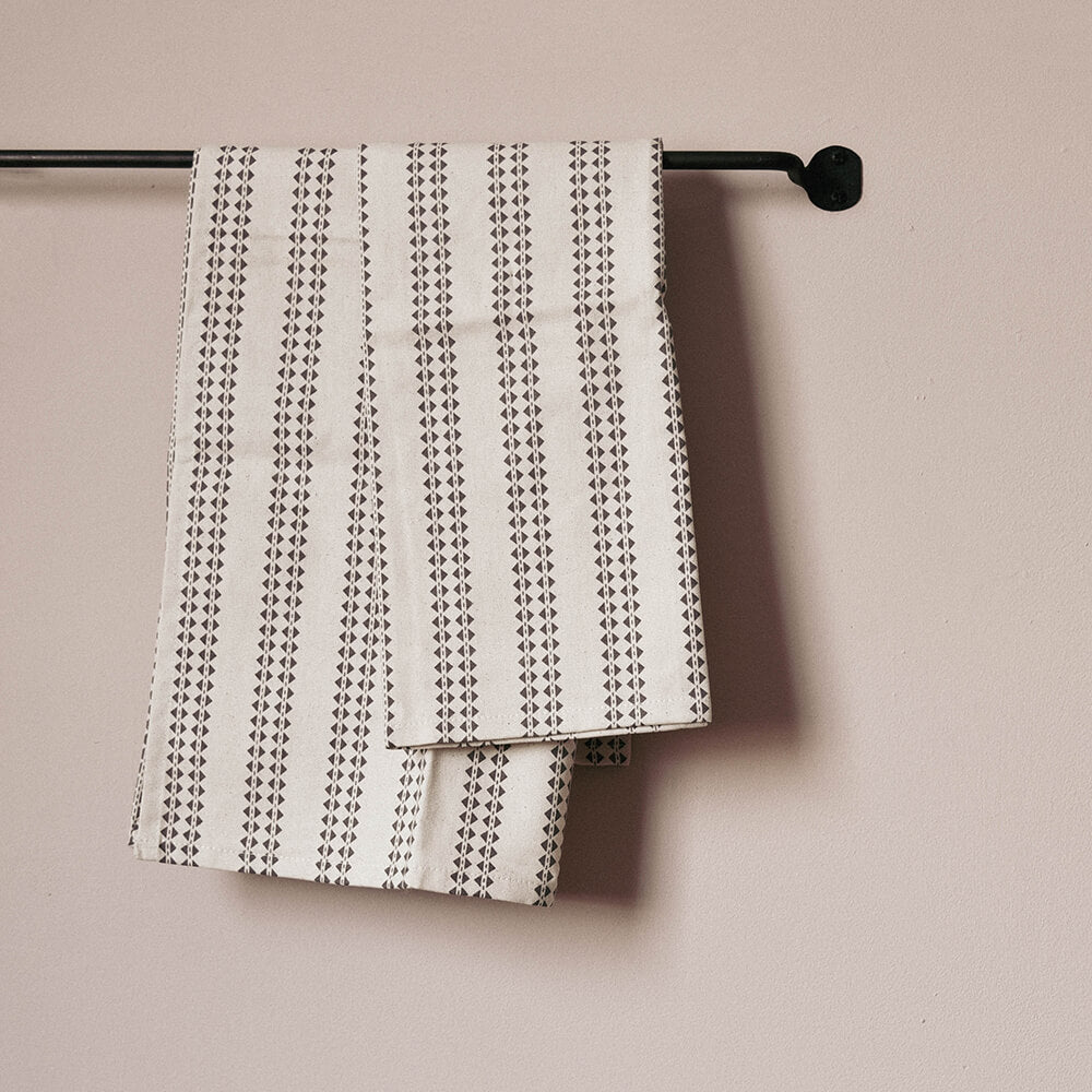 Tea Towels with geometric pattern on black rail