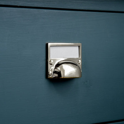 Hooded drawer pull with card frame