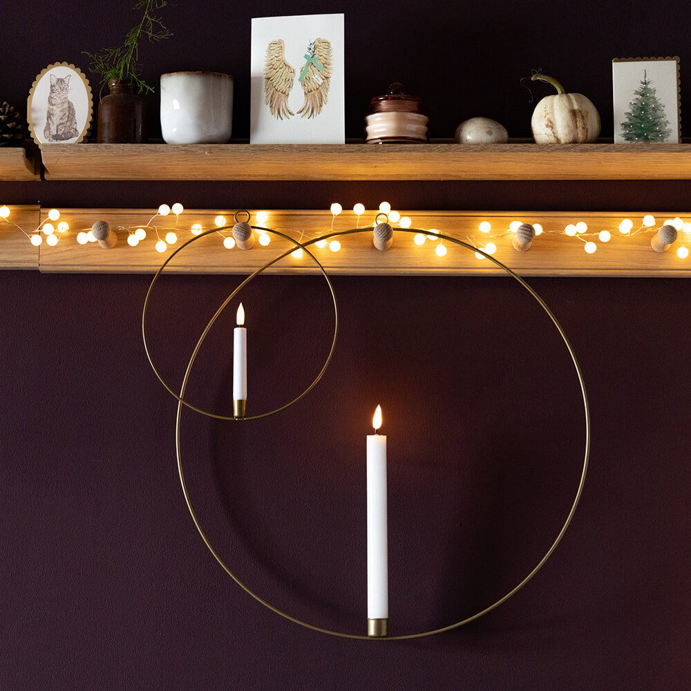 Hoop candle rings seen on reg rail along with cards and fairy lights