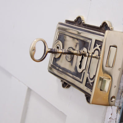 Large aged brass rim lock with key