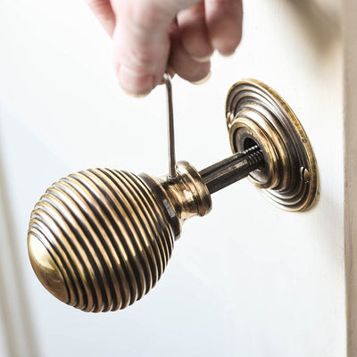 Large brass beehive door knob installation