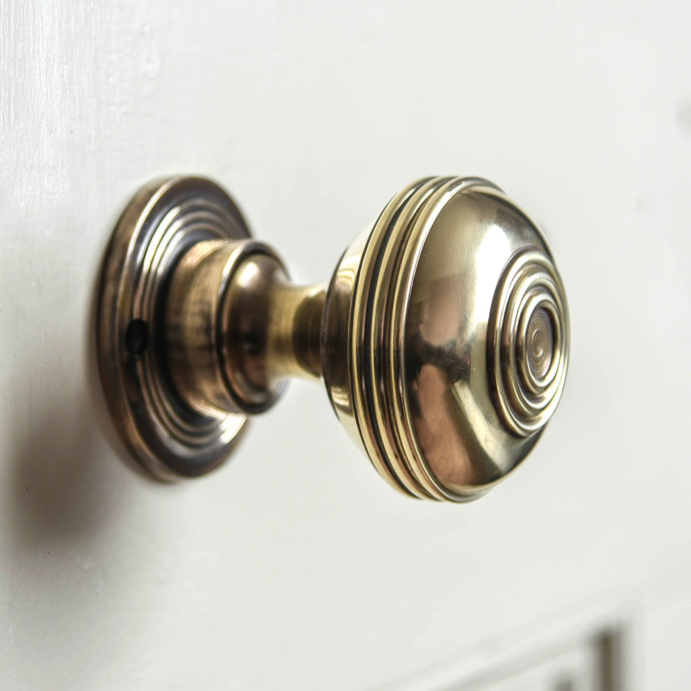 Large brass bloxwich door knobs side view