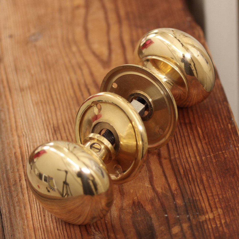 Large brass cottage bun door knobs with fittings