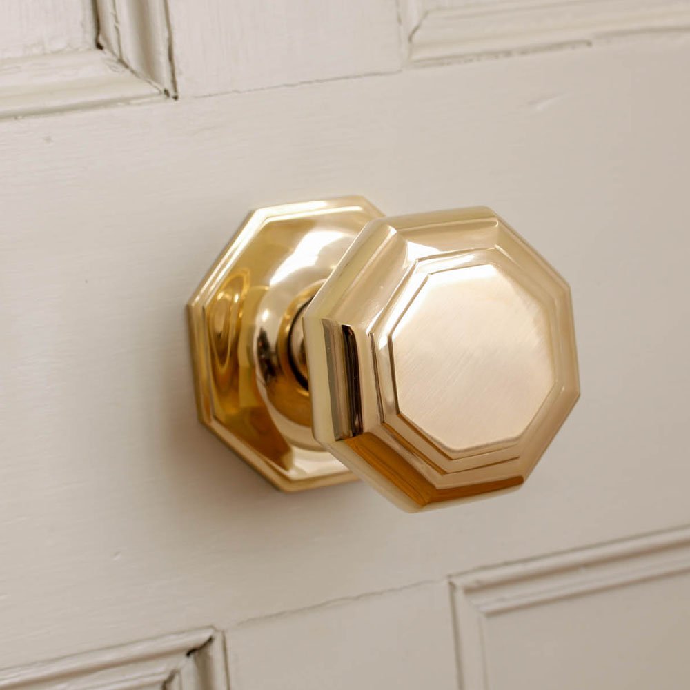 Large brass octagonal door pull front view