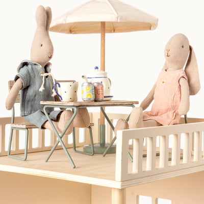 Maileg miniature garden set on decking with Maileg bunnies having tea