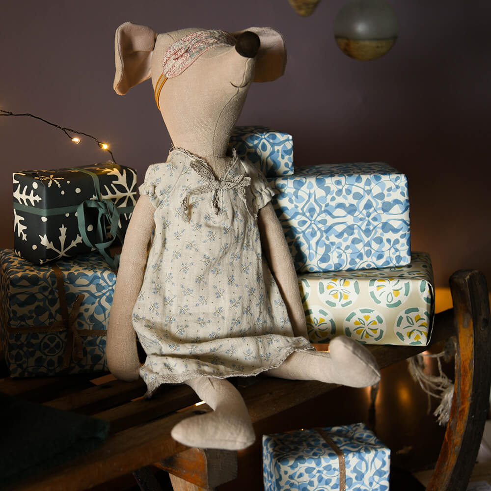 Nightgown mouse from maileg sat on a sleigh of gifts