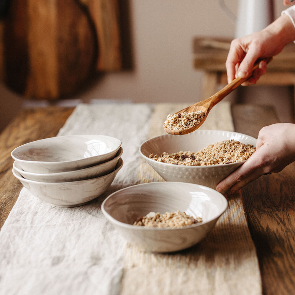 Maya Bowls on table with granola and spoon