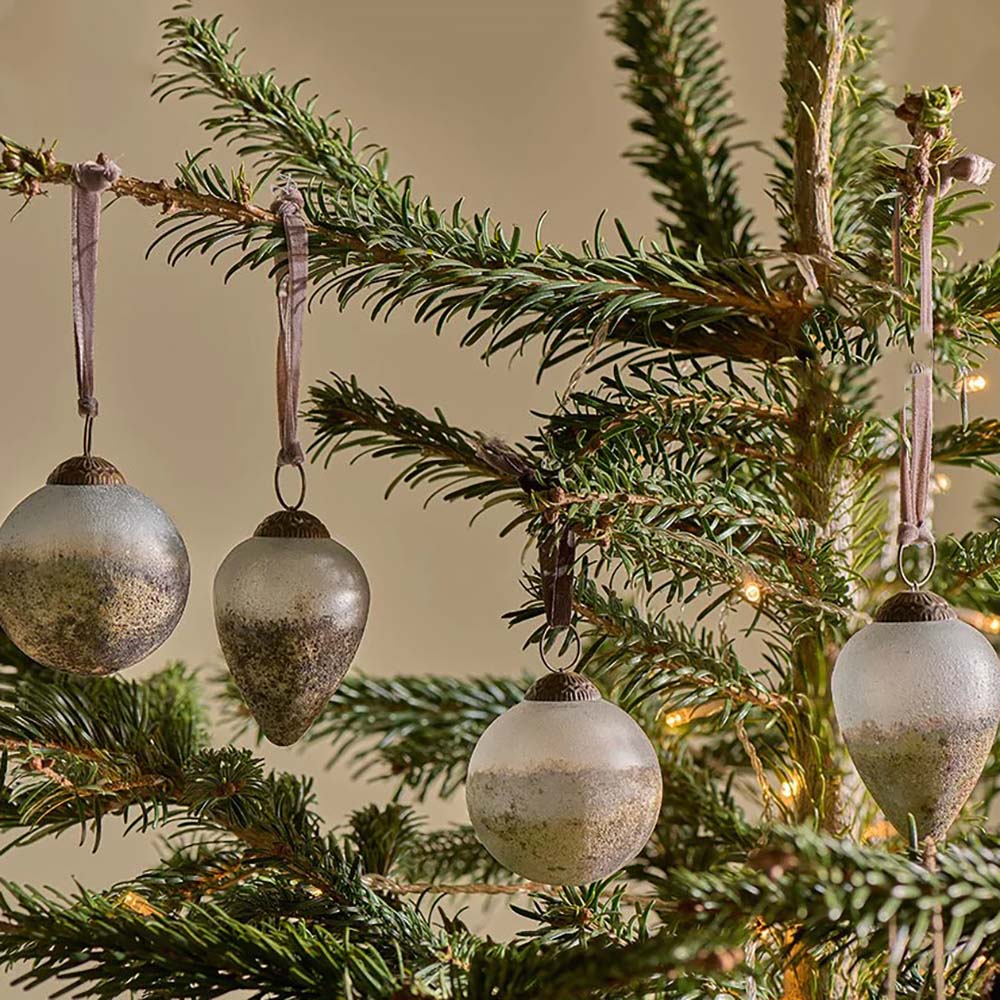 Ngolo Set of 4 Baubles hanging from a traditional christmas tree
