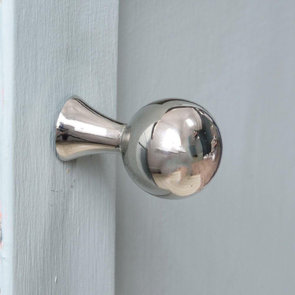 Ball shaped cabinet knob with slender tapered neck