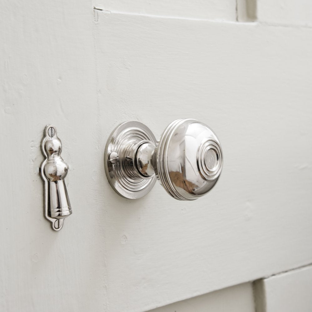 Nickel regency bloxwich door knob on white door