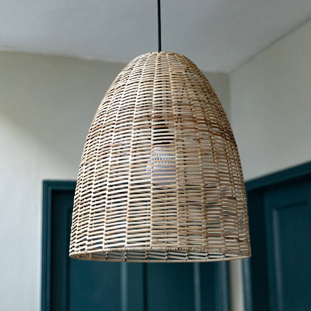 Wicker conical shaped pendant light fitting in a hallway with blue doors.